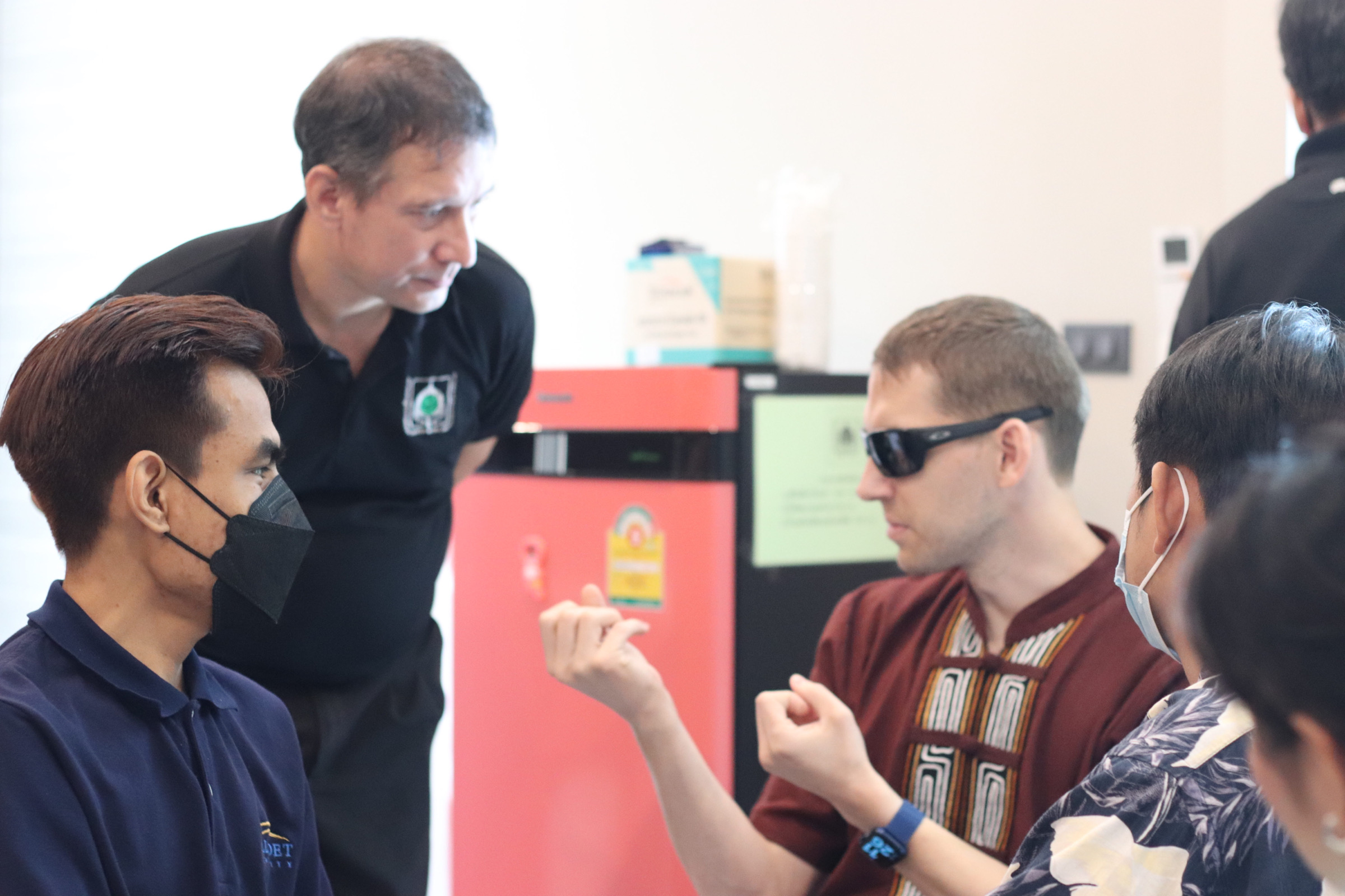 Participants engaged in hands-on communication training during an accessibility and inclusion workshop.